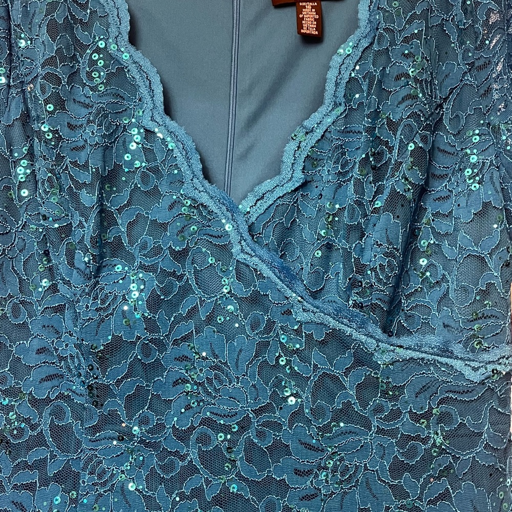 Beautiful turquoise, new with tags.  Lightweight-evening wear